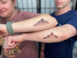 matching mountain tattoos